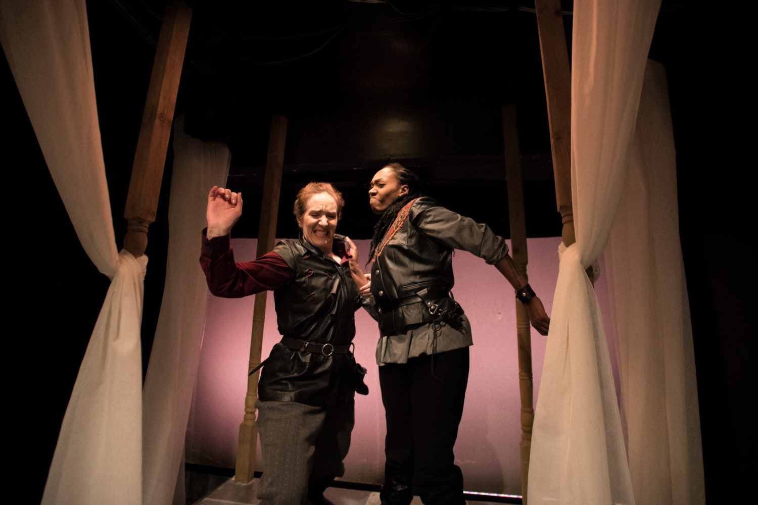 Othello shoves Iago away