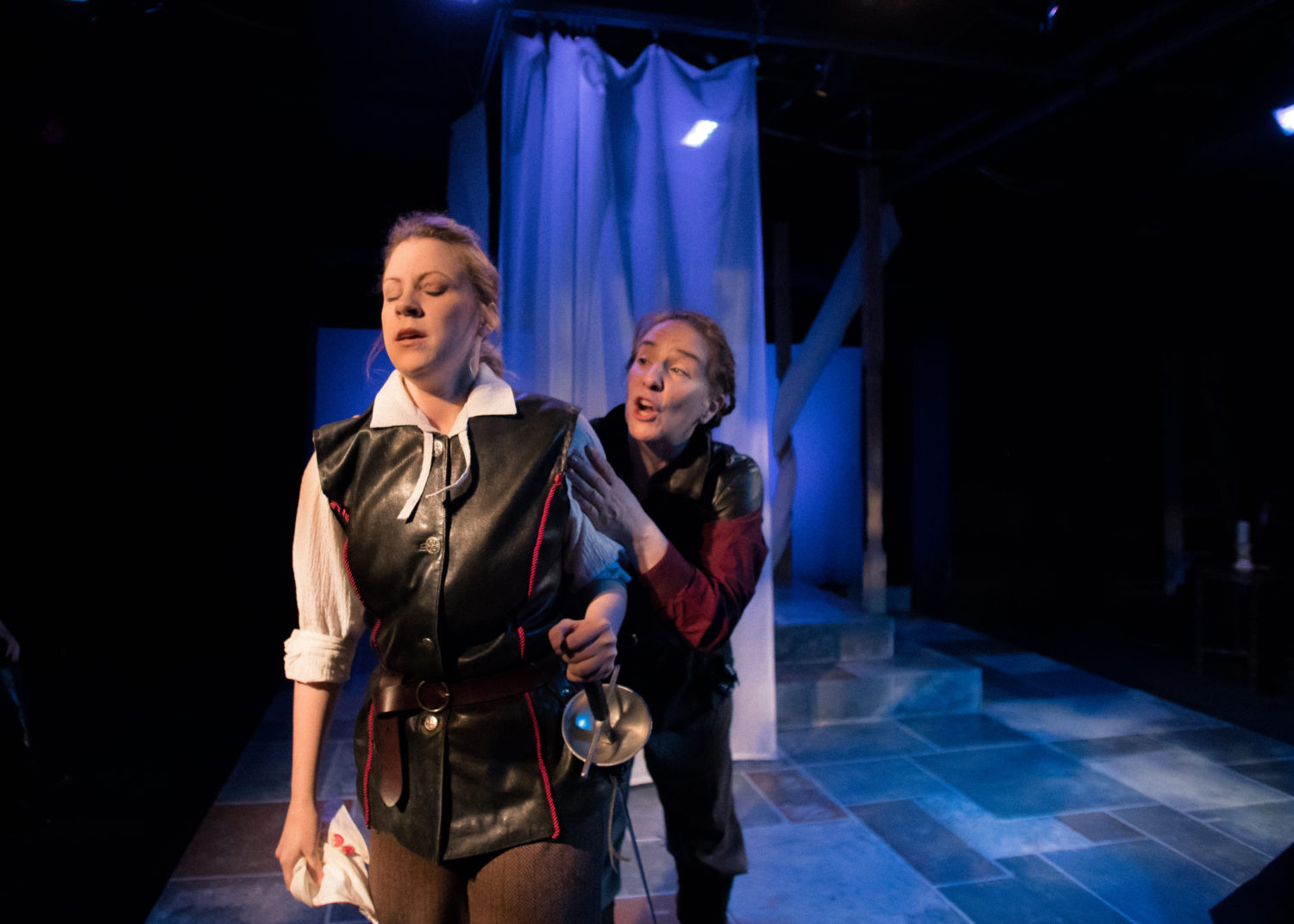 Iago talks to Cassio who is holding a handkerchief